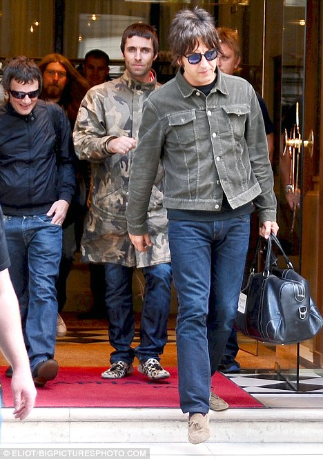 Oasis band members Liam Gallagher, Alan White, Gem Archer and Andy Bellleave their Hotel and go to the Airport